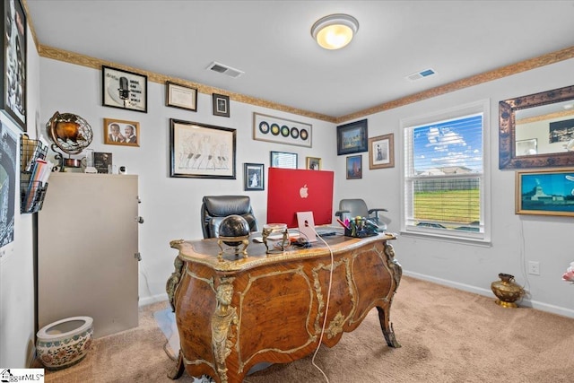 carpeted office space with visible vents and baseboards