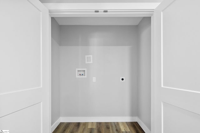 clothes washing area featuring laundry area, baseboards, dark wood-style flooring, washer hookup, and electric dryer hookup