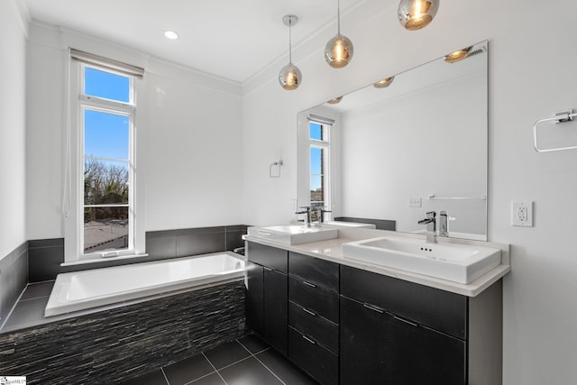 full bath featuring tiled tub, double vanity, a sink, and tile patterned floors