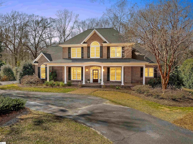 view of front of property featuring brick siding