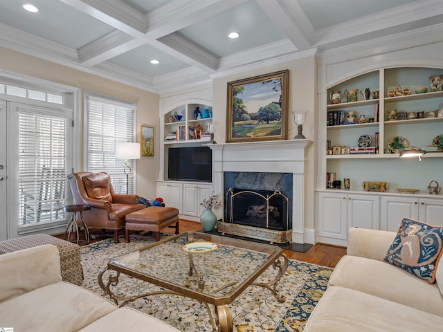 living room featuring built in features, coffered ceiling, wood finished floors, beam ceiling, and a high end fireplace