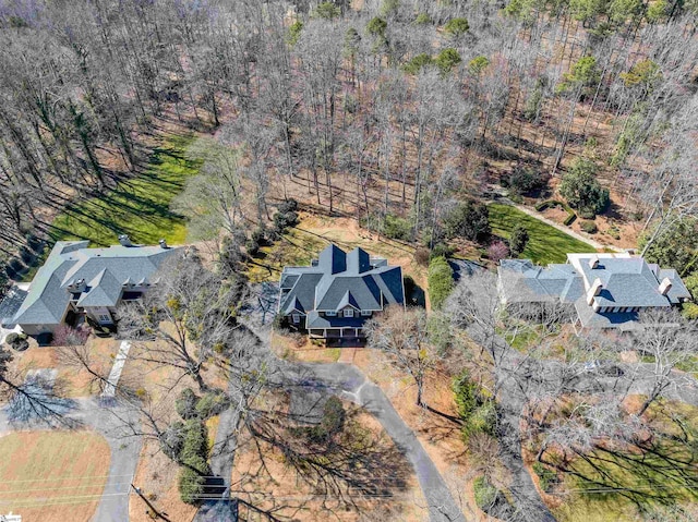 bird's eye view featuring a wooded view