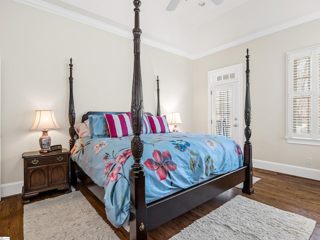 bedroom featuring ornamental molding, baseboards, and wood finished floors