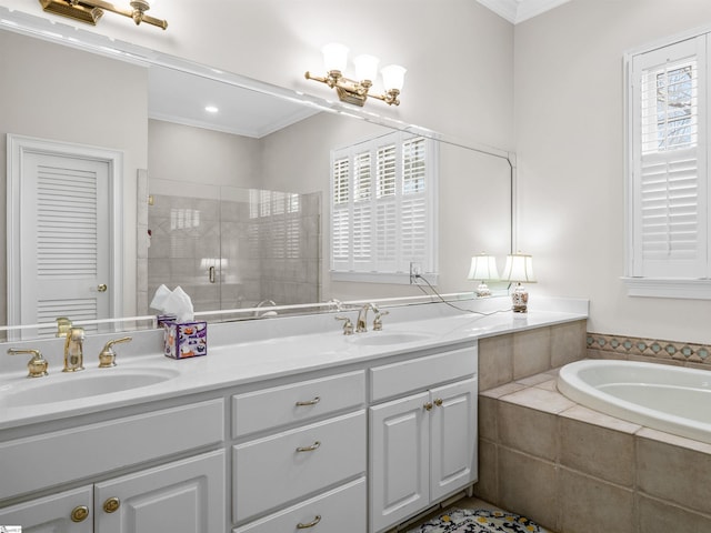 full bath featuring a garden tub, double vanity, a stall shower, and a sink