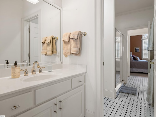 ensuite bathroom featuring ornamental molding, vanity, and ensuite bathroom