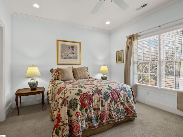 carpeted bedroom featuring ceiling fan, recessed lighting, visible vents, baseboards, and ornamental molding