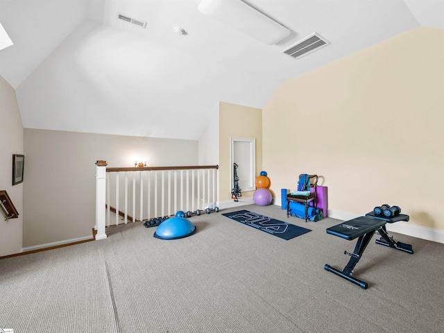 workout room with lofted ceiling, carpet floors, visible vents, and baseboards