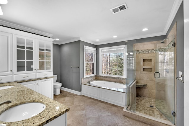 bathroom with toilet, visible vents, a sink, and ornamental molding