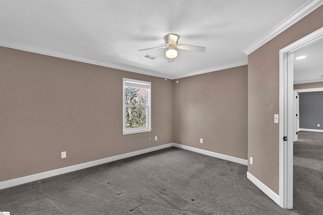 empty room featuring ornamental molding, visible vents, dark carpet, and baseboards