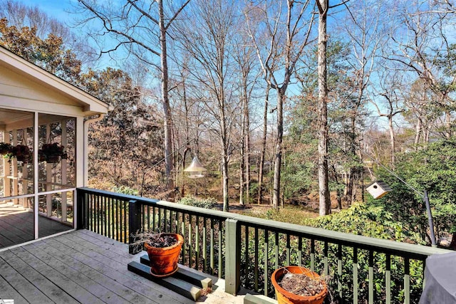 wooden deck featuring a sunroom