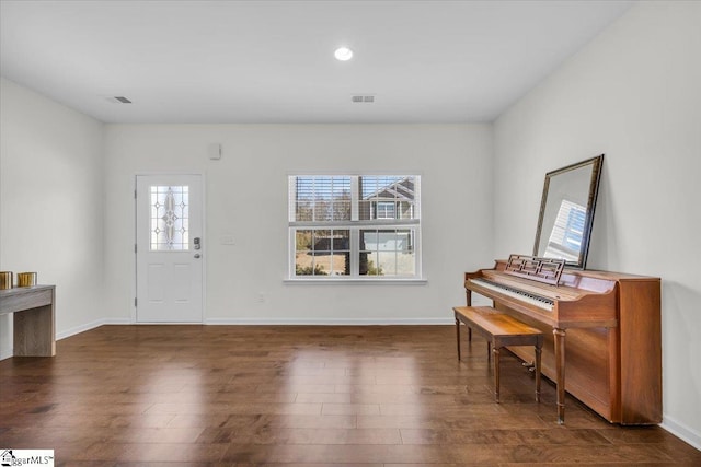 foyer entrance featuring recessed lighting, visible vents, baseboards, and wood finished floors