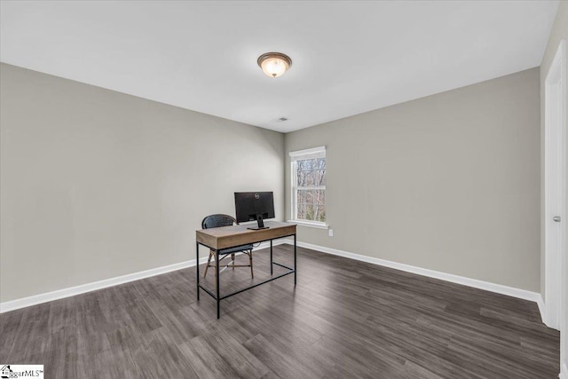 home office with dark wood finished floors and baseboards