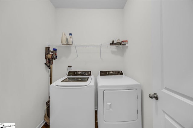 clothes washing area with washer and dryer and laundry area