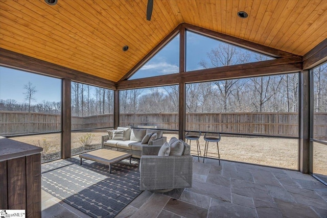 sunroom / solarium featuring wooden ceiling and vaulted ceiling