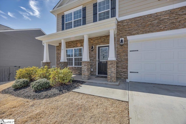 property entrance with stone siding and covered porch