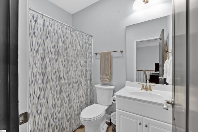 full bathroom with toilet, vanity, and a shower with curtain