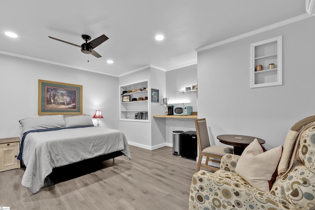 bedroom with crown molding, light wood finished floors, recessed lighting, a ceiling fan, and baseboards