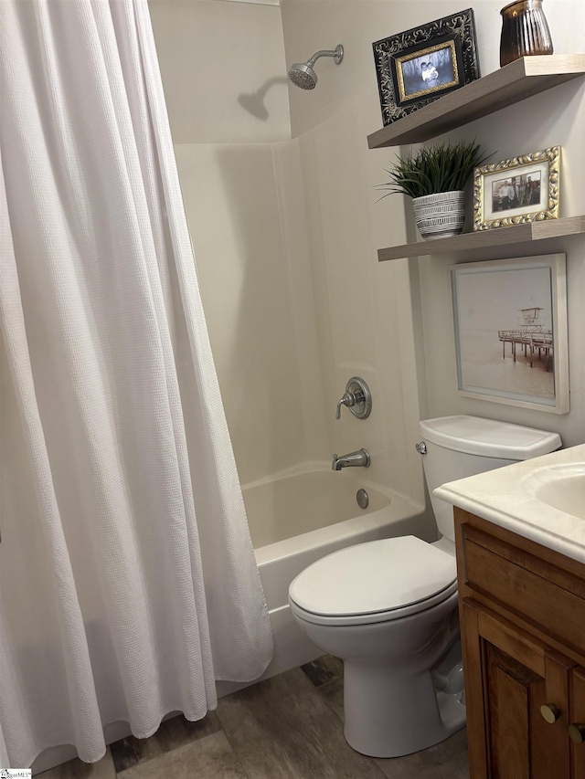 bathroom featuring shower / bath combo, vanity, and toilet