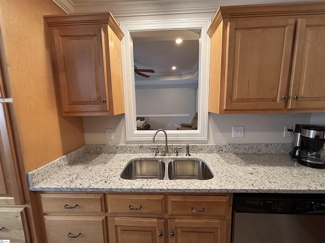 kitchen with a ceiling fan, dishwasher, a sink, and light stone countertops