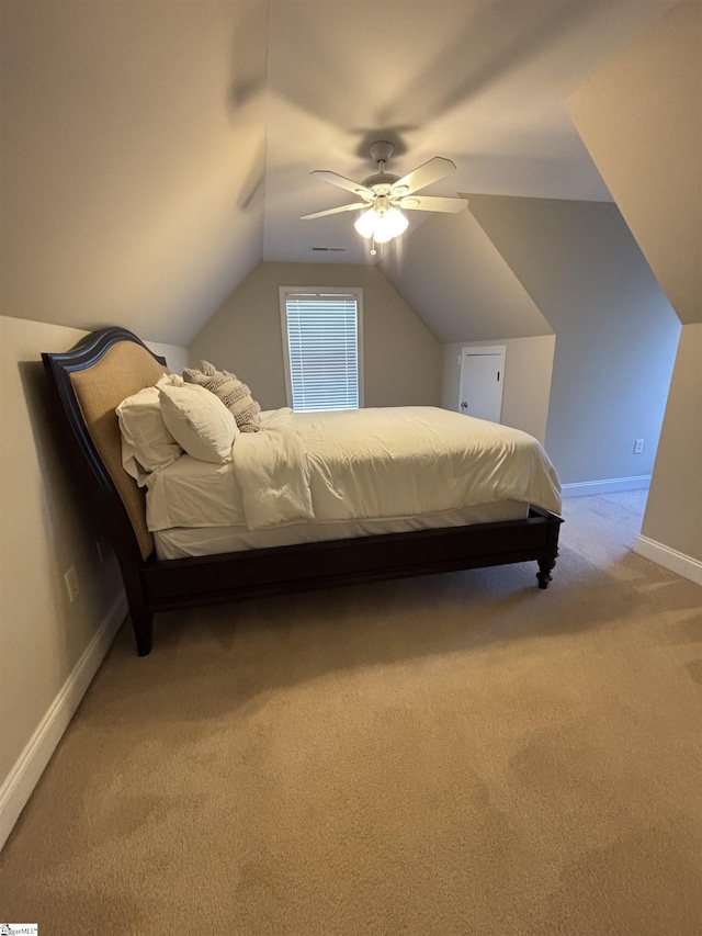 bedroom featuring visible vents, baseboards, ceiling fan, vaulted ceiling, and carpet floors