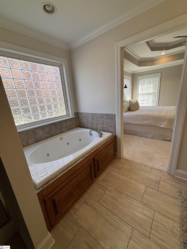 ensuite bathroom with a whirlpool tub, ornamental molding, connected bathroom, and wood tiled floor