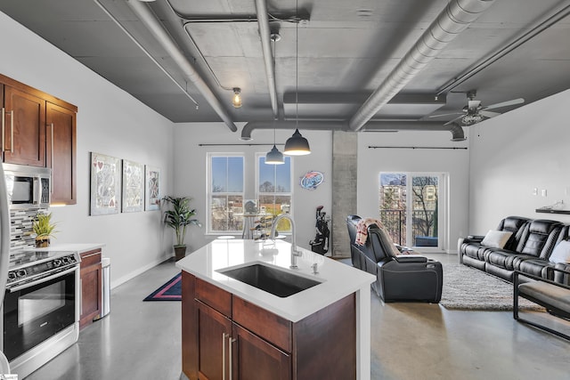 kitchen featuring stainless steel microwave, electric stove, concrete floors, and a sink