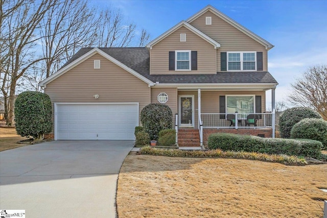 traditional-style house featuring covered porch, driveway, roof with shingles, and an attached garage