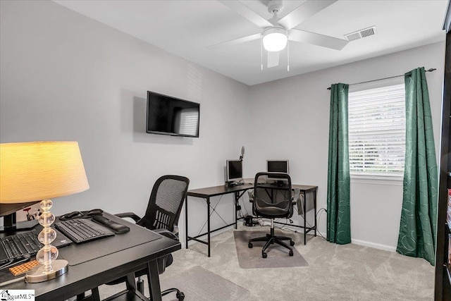 office area with baseboards, carpet, visible vents, and a ceiling fan