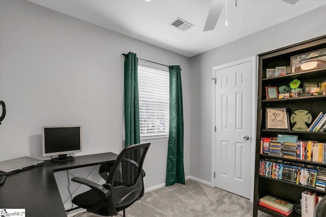 office with light carpet, ceiling fan, visible vents, and baseboards