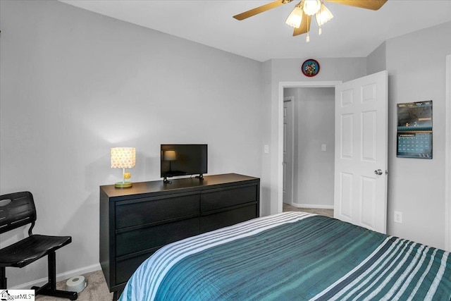 bedroom featuring a ceiling fan, baseboards, and carpet flooring