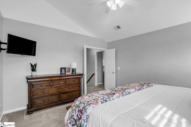 bedroom with baseboards, visible vents, lofted ceiling, ceiling fan, and carpet flooring