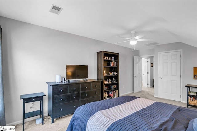 bedroom with baseboards, visible vents, and light colored carpet