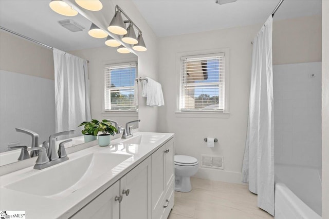 full bathroom featuring toilet, a sink, and visible vents