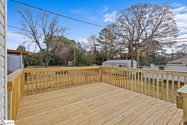 wooden terrace with an outbuilding