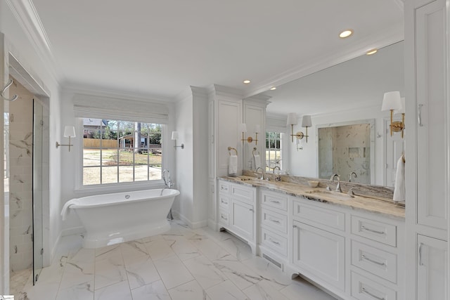 full bathroom featuring a freestanding tub, marble finish floor, a marble finish shower, double vanity, and crown molding