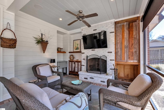 interior space featuring wooden ceiling, a fireplace, and ceiling fan