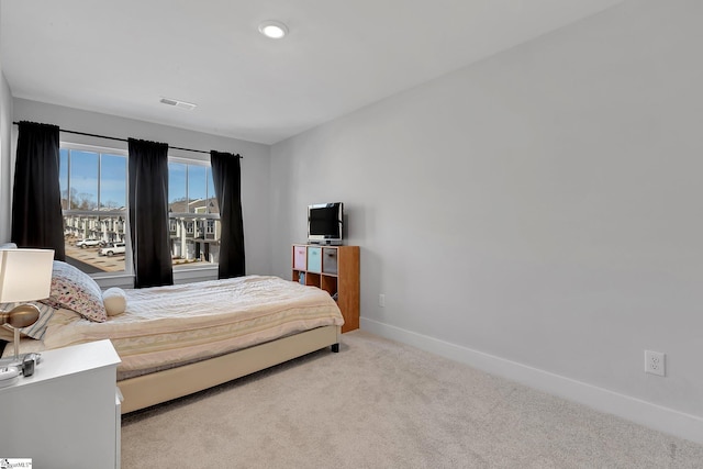 bedroom featuring carpet, visible vents, and baseboards