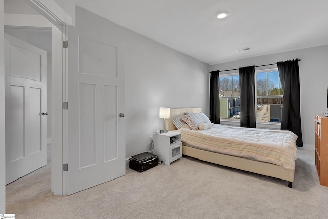 carpeted bedroom featuring visible vents and recessed lighting