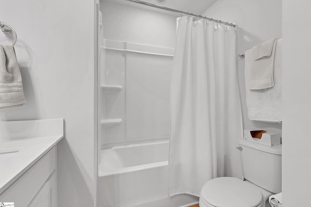 bathroom featuring vanity, toilet, and shower / bath combo with shower curtain