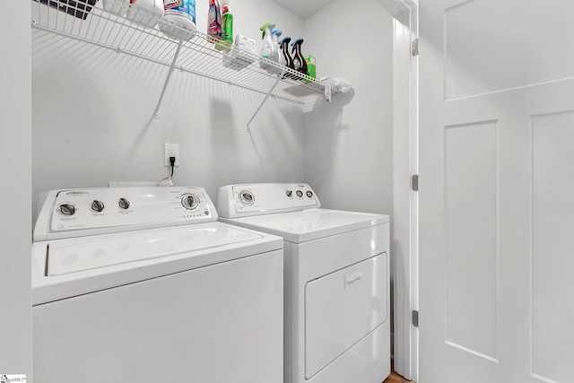 washroom with laundry area and washing machine and dryer