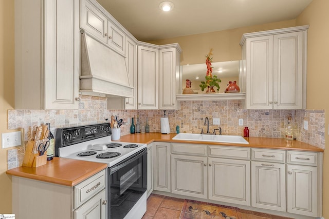 4101 Abbeville Hwy, Anderson, SC 29624 - kitchen with wall chimney range hood, electric range, decorative backsplash, and a sink