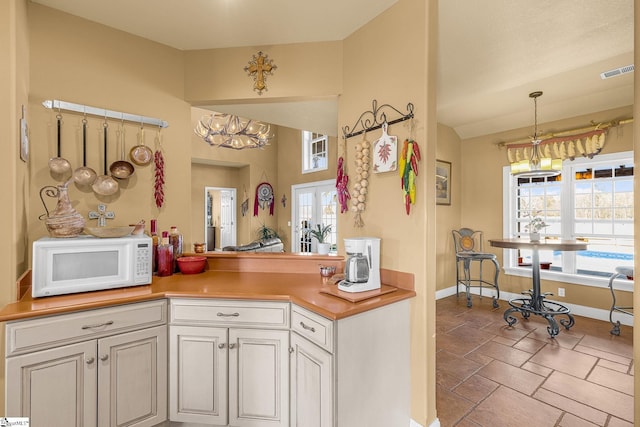 4101 Abbeville Hwy, Anderson, SC 29624 - kitchen with lofted ceiling, white microwave, plenty of natural light, and visible vents
