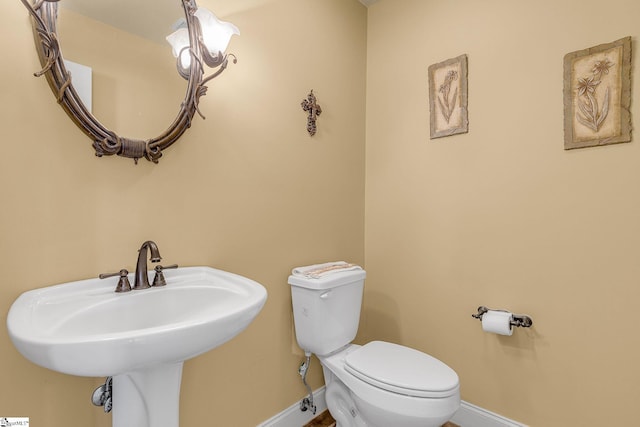 4101 Abbeville Hwy, Anderson, SC 29624 - bathroom featuring a sink, toilet, and baseboards
