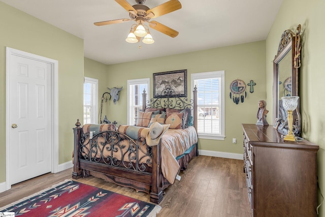4101 Abbeville Hwy, Anderson, SC 29624 - bedroom with a ceiling fan, multiple windows, baseboards, and wood finished floors
