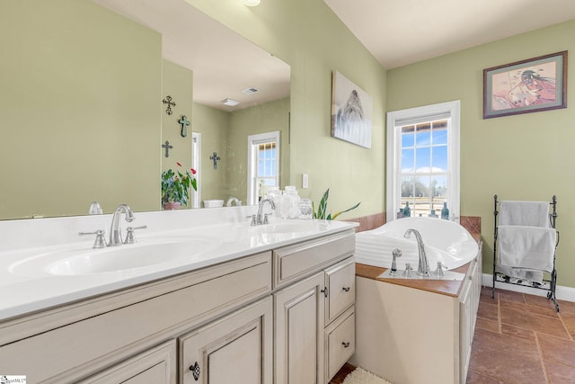 4101 Abbeville Hwy, Anderson, SC 29624 - bathroom with double vanity, a garden tub, stone finish flooring, and a sink