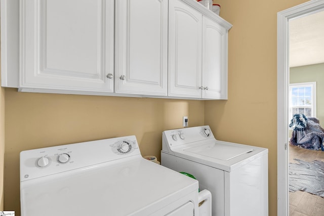 4101 Abbeville Hwy, Anderson, SC 29624 - laundry room with cabinet space, independent washer and dryer, and wood finished floors