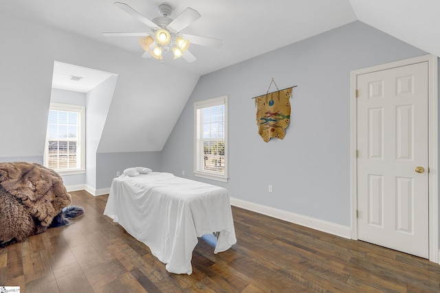 4101 Abbeville Hwy, Anderson, SC 29624 - bedroom with dark wood-style flooring, multiple windows, vaulted ceiling, and baseboards