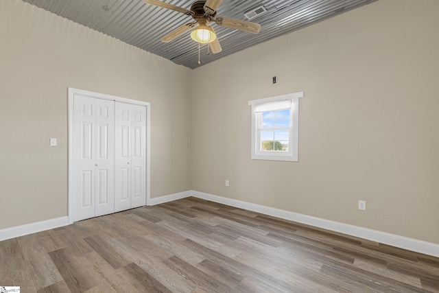 4101 Abbeville Hwy, Anderson, SC 29624 - unfurnished bedroom with wood finished floors, visible vents, a ceiling fan, baseboards, and a closet