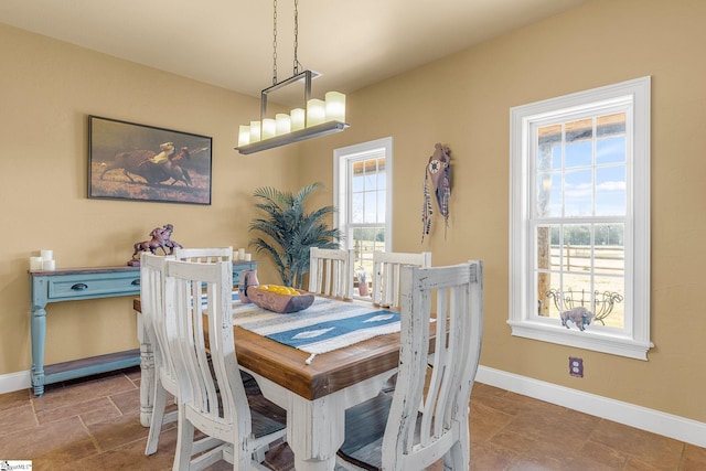 4101 Abbeville Hwy, Anderson, SC 29624 - dining area with stone finish flooring, baseboards, and a chandelier