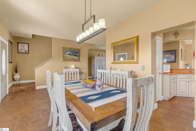 4101 Abbeville Hwy, Anderson, SC 29624 - dining space with baseboards and stone tile flooring